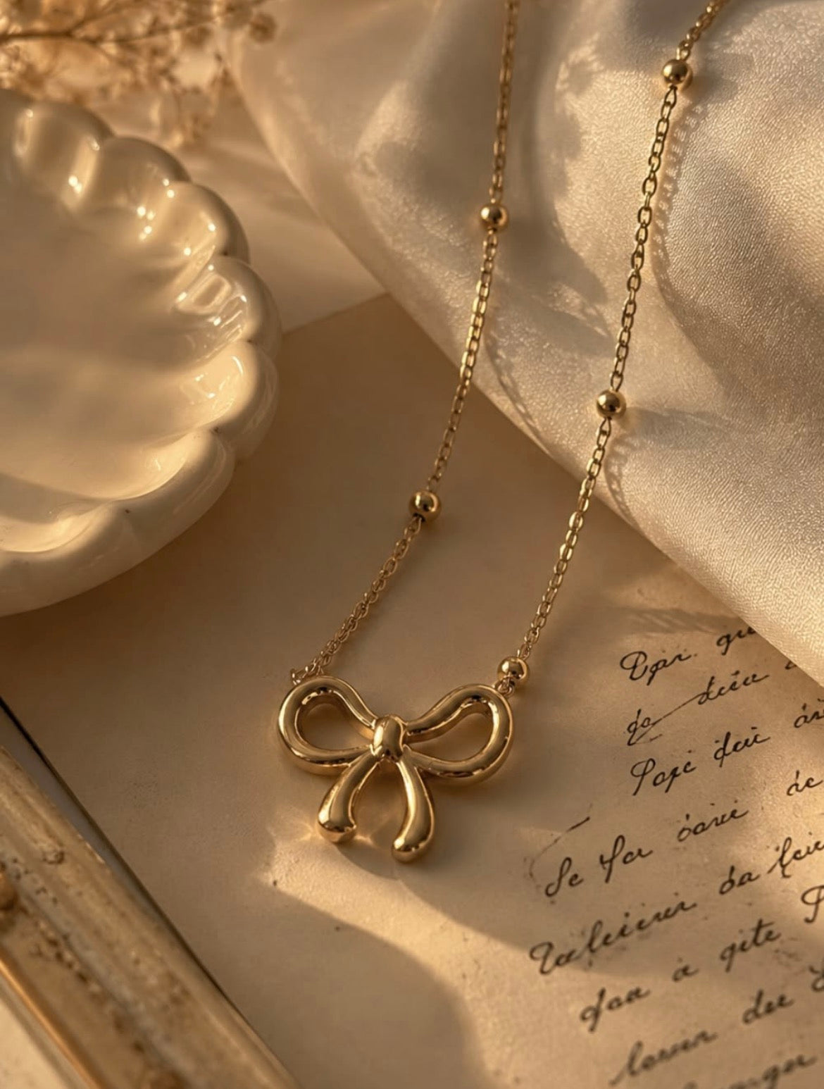 Golden Bow Charm Necklace